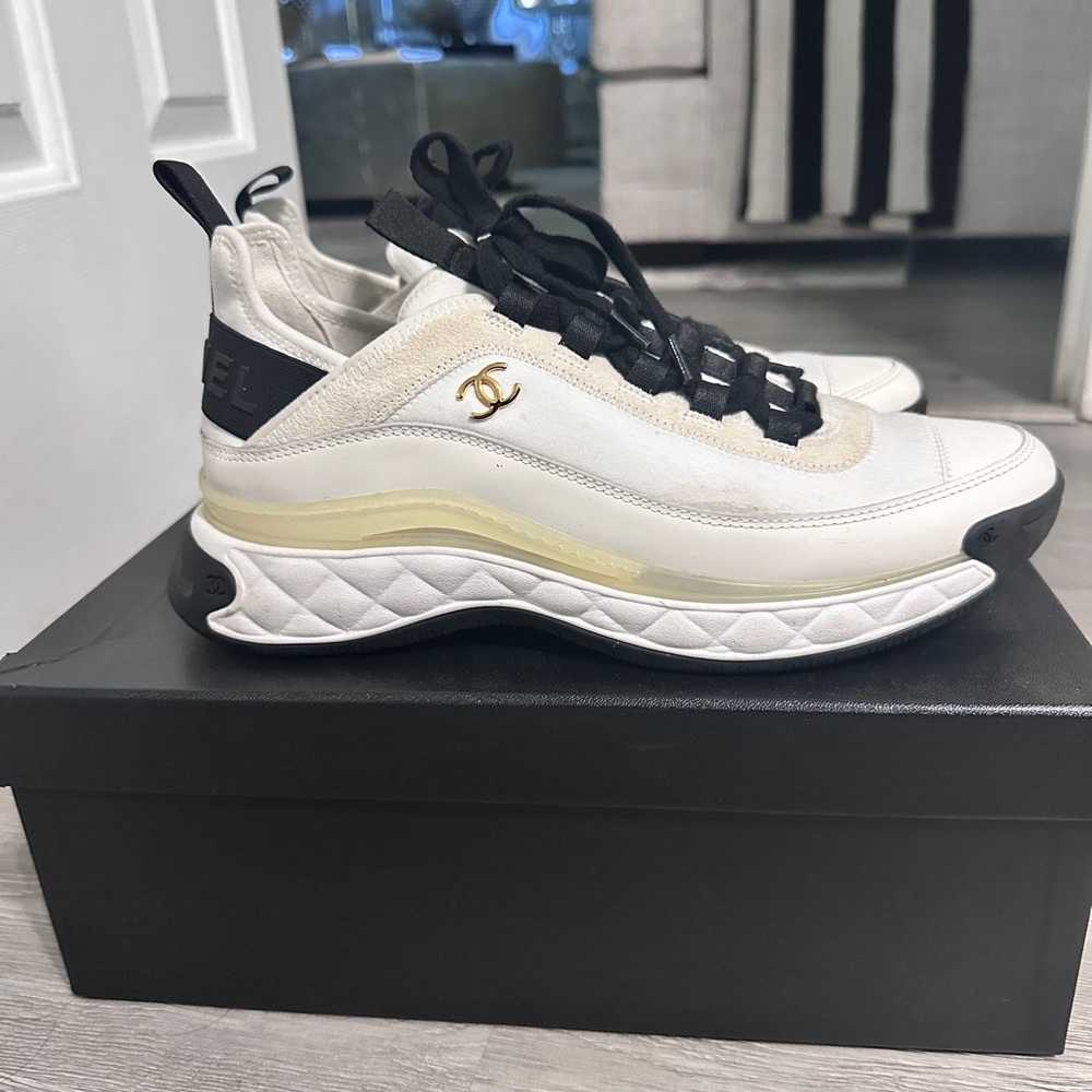 CHANEL Women's White and Black Sneakers with Gold Detail